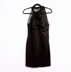 Apart black cocktail dress with sheer neckline and tie at neck. Size 8. Mild pil